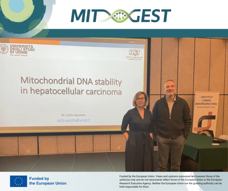 Two people standing in front of the screen with the presentation title Mitochondrial DNA stability in hepatocellular carcinoma
