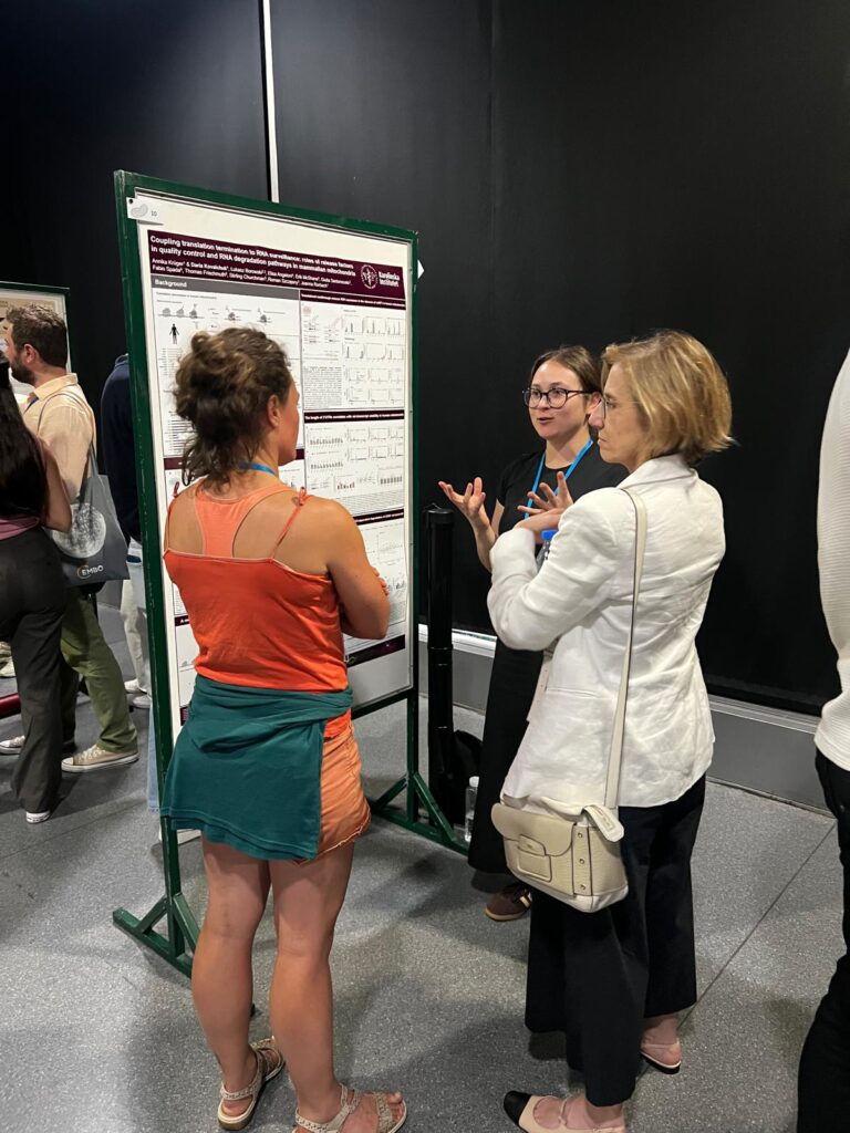 Doctoral candidate presenting poster