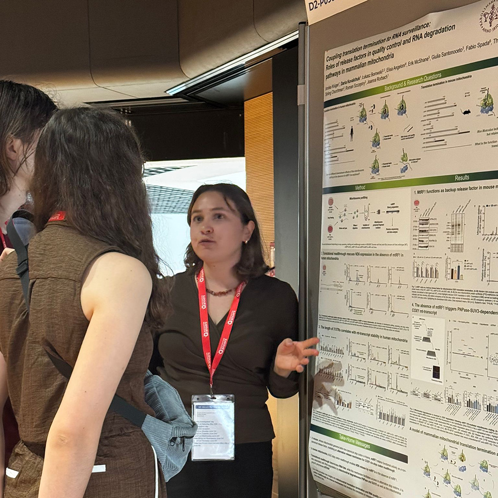 Woman researcher presenting poster